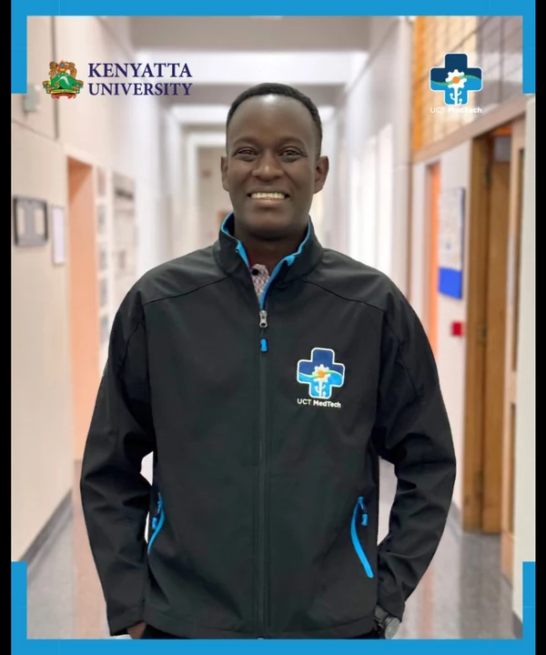 Ernest Bwogi in a UCT MedTech jacket in a corridor