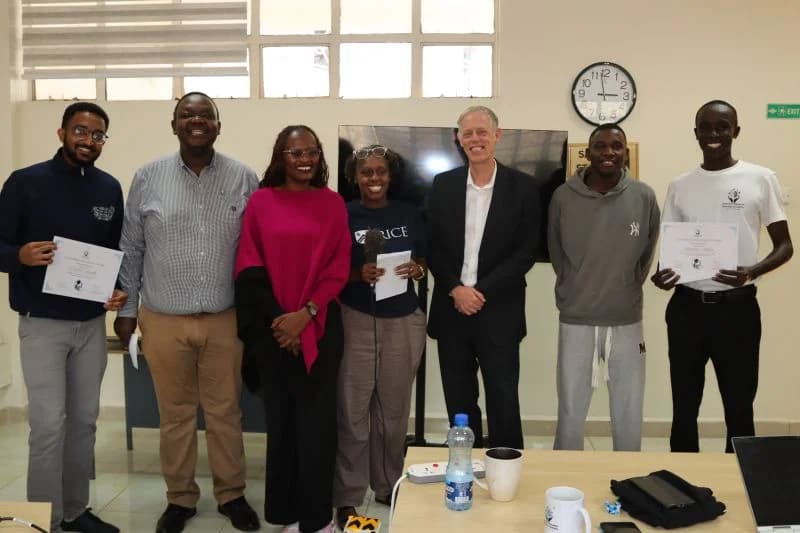 Second group of winners holding certificates beside CDIE staff and guests
