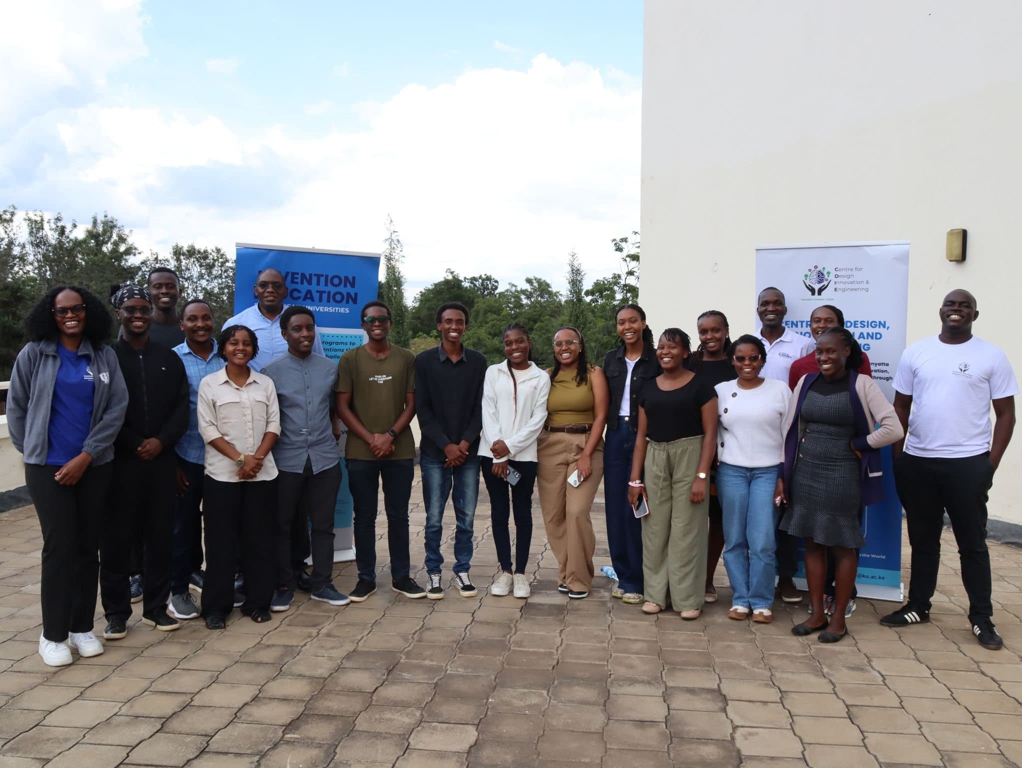 Summer program participants and staff in a group photo outside CDIE