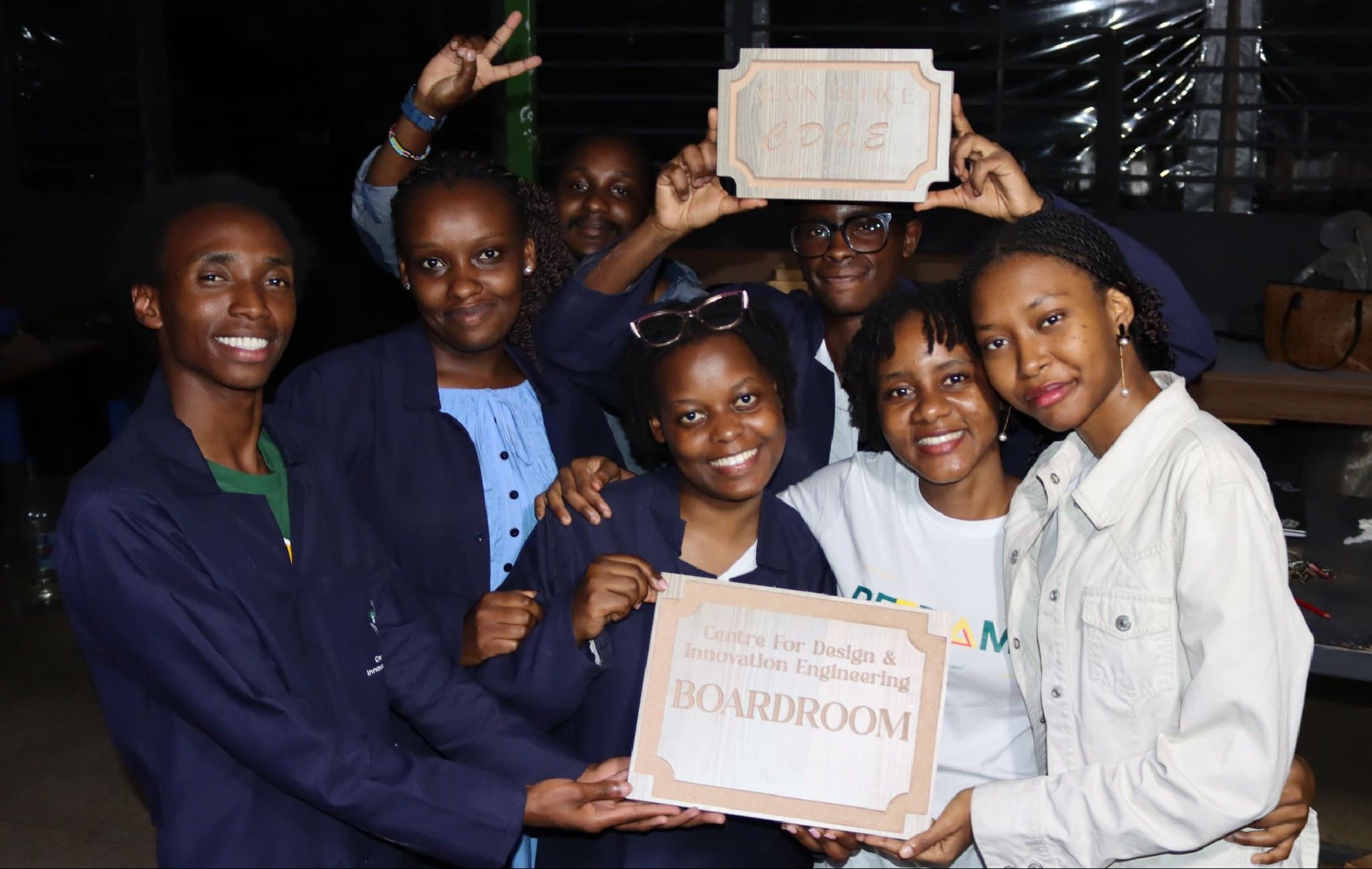 Participants holding up a sign they made in the workshop