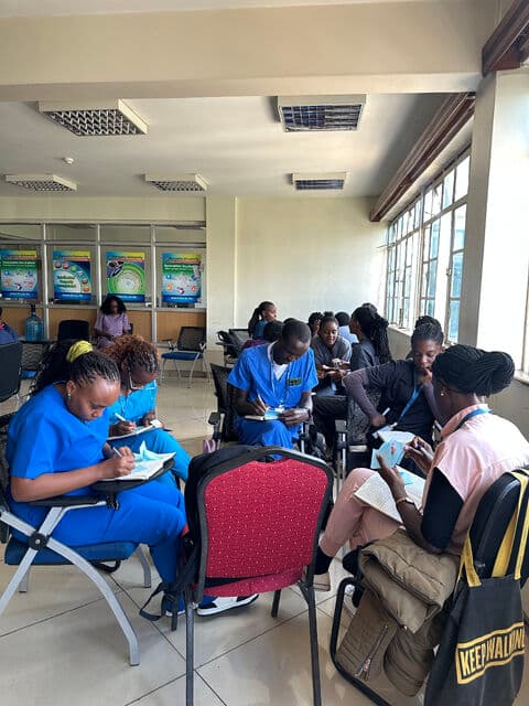 Participants working through needs filtering at tables